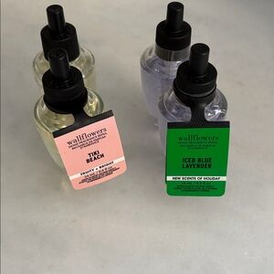 Bath & Body Works 4 Wallflowers refills: 2 Tiki Beach & 2 iced blue lavender.